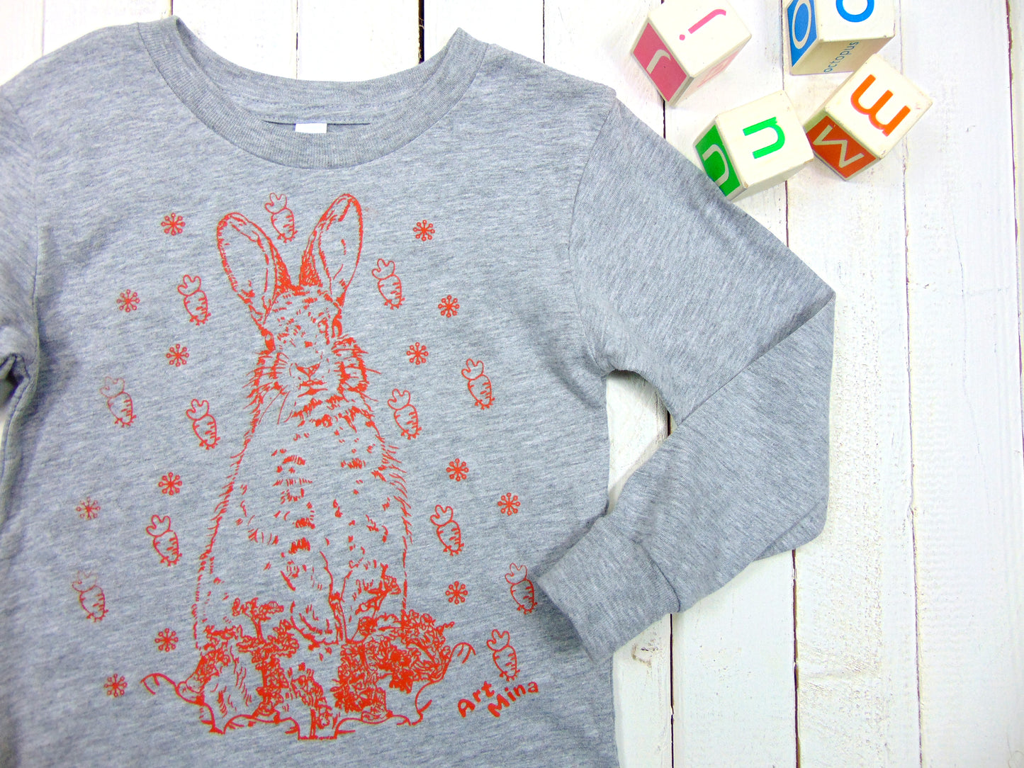 A photo of Art Mina Kids Long Sleeve T-shirt "Bunny Carrot"