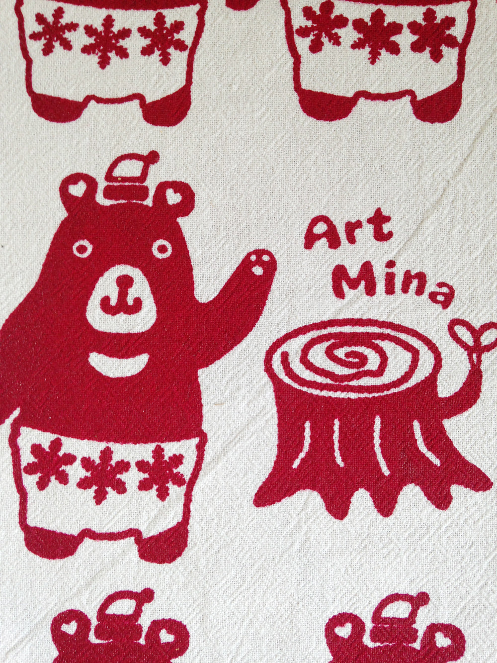 Close-up of a funny Christmas Bears design hand-printed on a tea towel