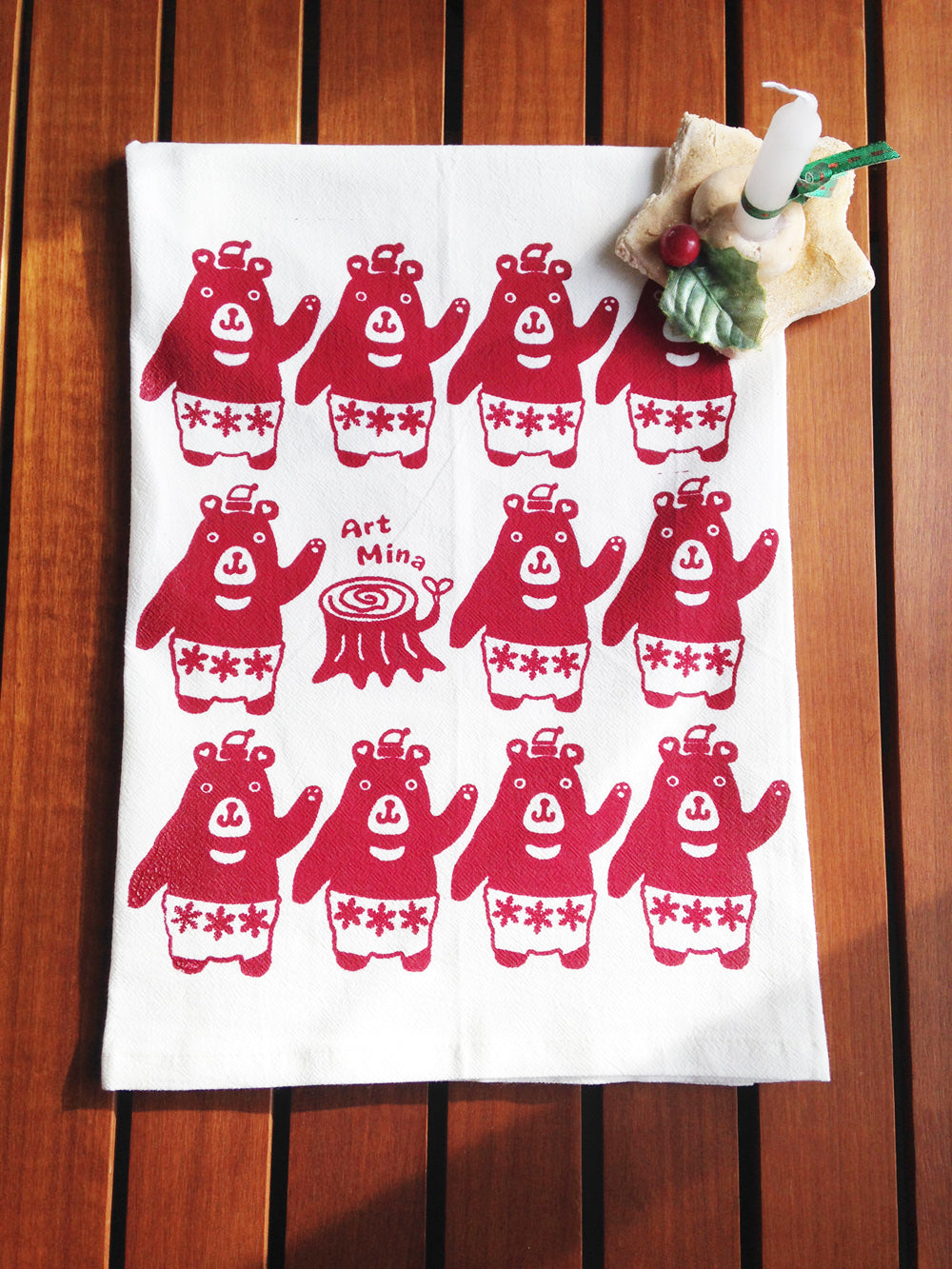 A photo of Art Mina Flour Sack Kitchen Tea Towel "Mele Kalikimaka! (Merry Christmas!) Bear"