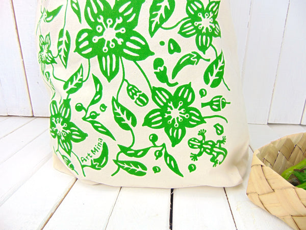 A photo of Art Mina Canvas Tote Bag "Aunty's Shishito Pepper Garden with Lucky Gecko "